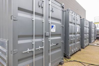 Close-up grey containerized boilers placed in a row next to each other.