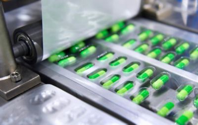 Pharmaceutical medication packaging on a conveyor belt