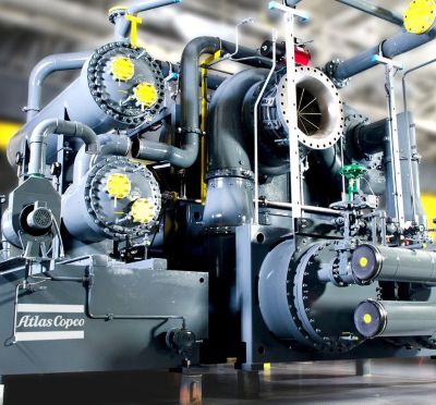 Cover image for the Q1 2025 report featuring an Atlas Copco compressor