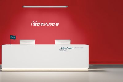 Single brand logo (Edwards) prominently seen above reception desk.
