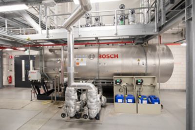 Side view of a Bosch steam boiler placed at a steam plant.