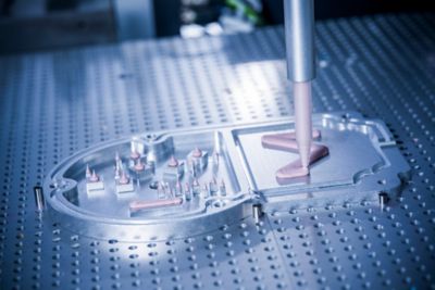 Close up gap filler application on an E-compressor for thermal management