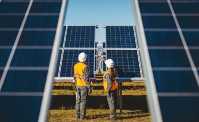 Solar panels and two service technicians 