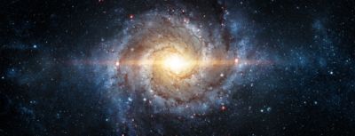 A view from space to a spiral galaxy and stars.
