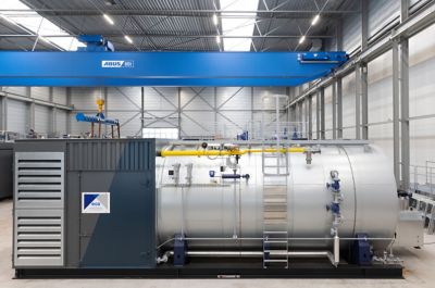 A 16 t/h industrial boiler From Eco Steam and Heating Solutions in a factory setting mounted on a frame. Ready to provide temporary steam and hot water. 
