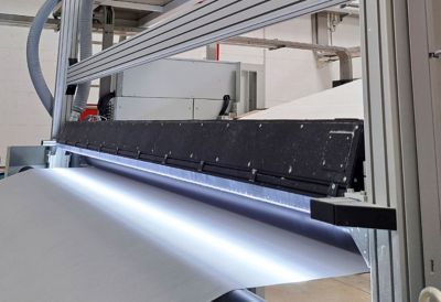 nonwovens web with surface inspection system  illumination