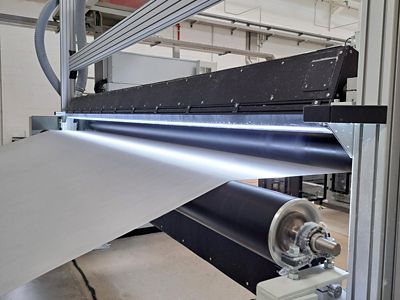 nonwovens web with surface inspection system  illumination