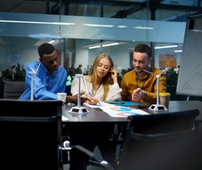 Three colleagues working in an office