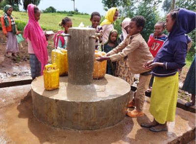 Children enjoying easy access to clean water.