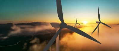 Wind turbines against the sunset.