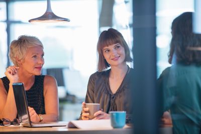 Businesswomen talking in office meeting